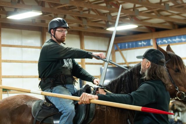 Lancer on left has caught infantryman's (on right) sword in his katar.